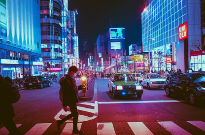 man walking in a street in Asia